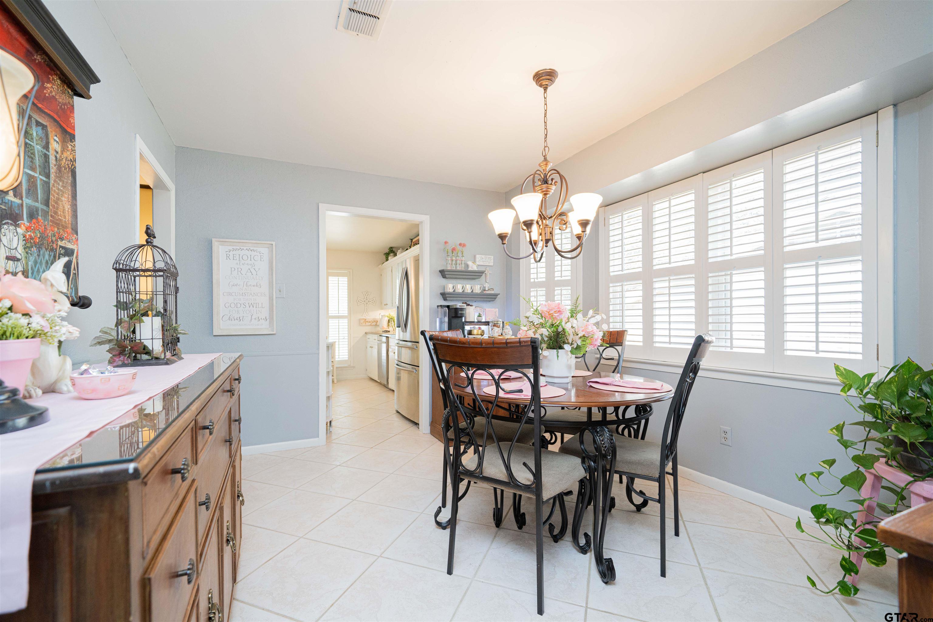 209 Cheryl Street Longview, TX 75604 - Photo 13 of 41 a view of a dining room with furniture window and outside view