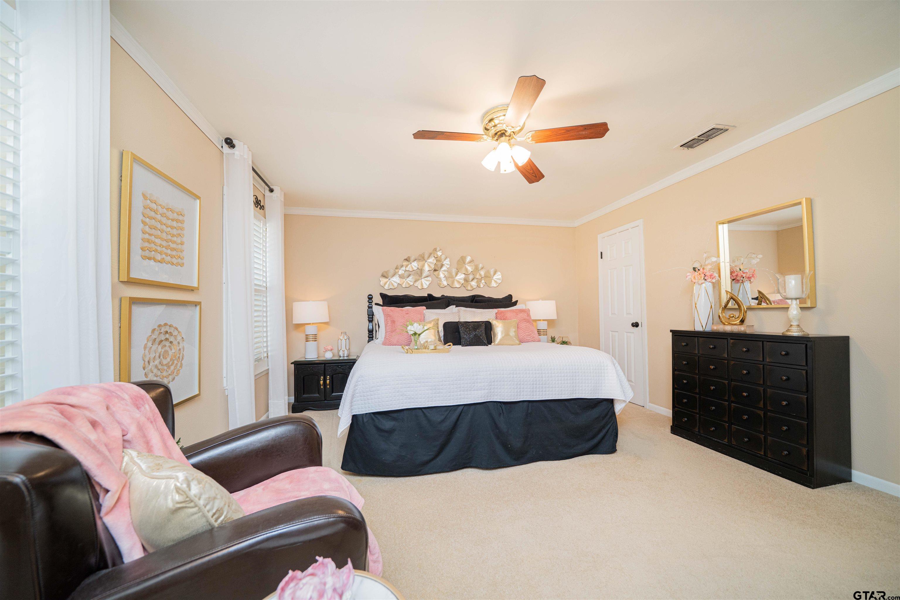 209 Cheryl Street Longview, TX 75604 - Photo 15 of 41 a bedroom with a bed and wooden floor