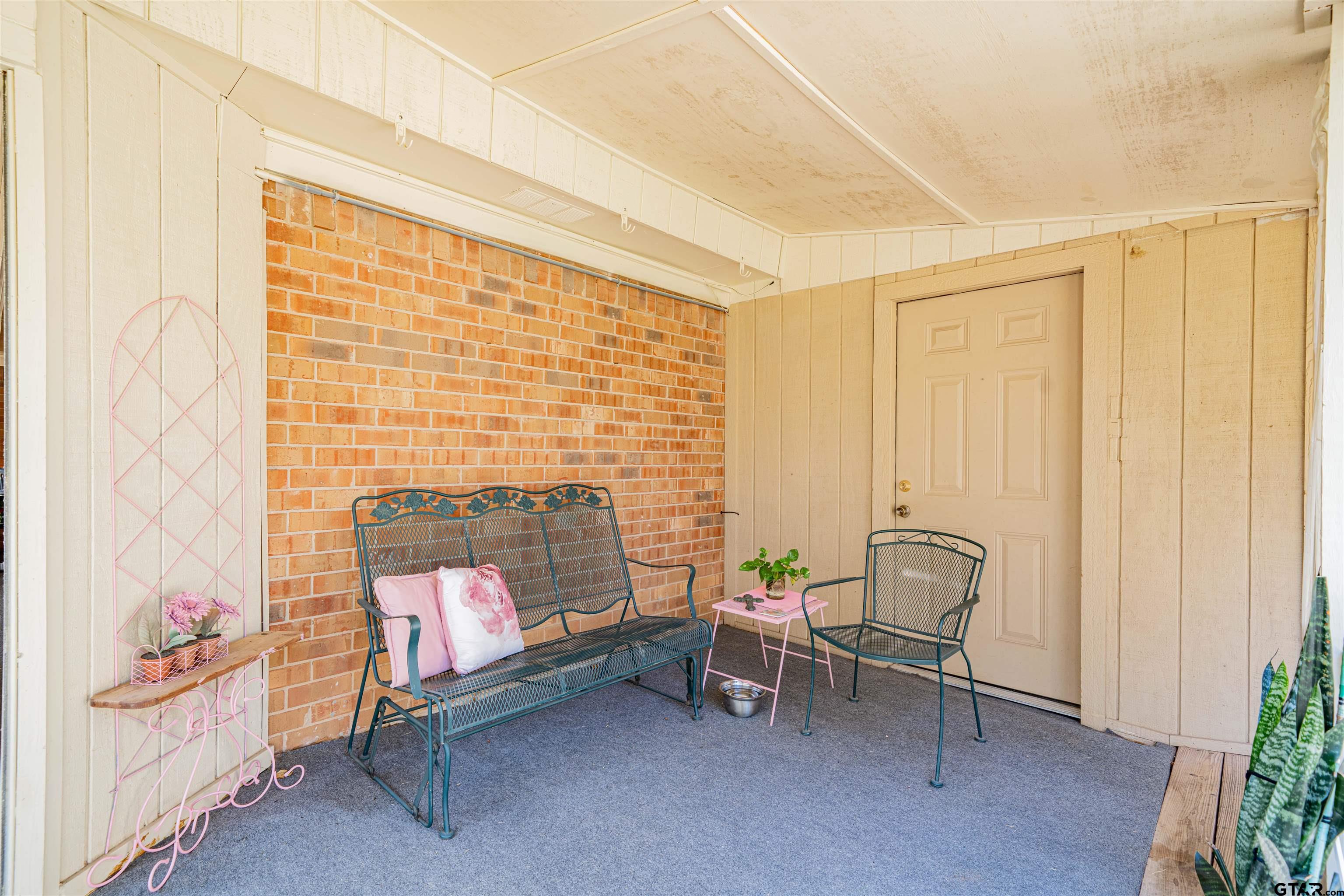209 Cheryl Street Longview, TX 75604 - Photo 30 of 41 a living room with furniture and a fireplace