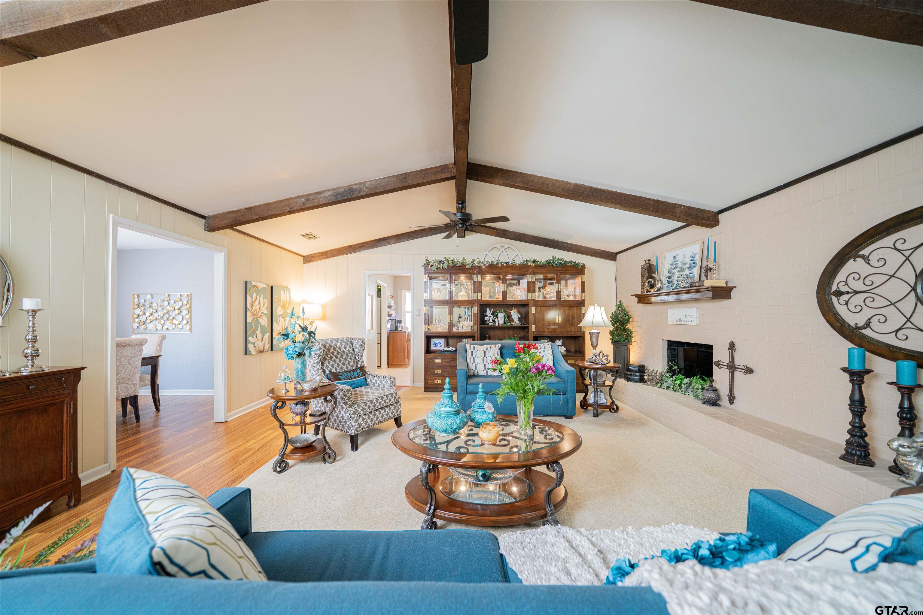 209 Cheryl Street Longview, TX 75604 - Photo 3 of 41 a living room with fireplace furniture and a large window