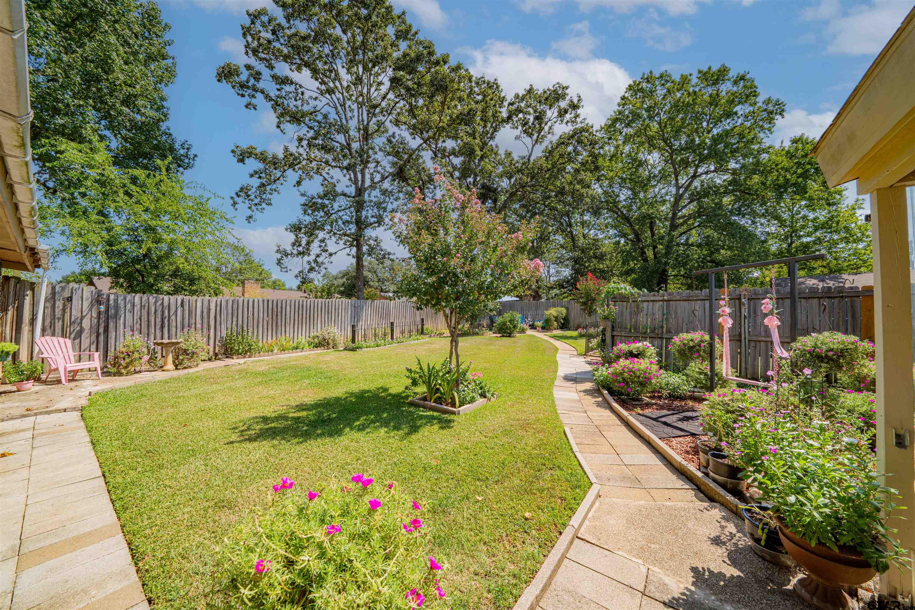 209 Cheryl Street Longview, TX 75604 - Photo 31 of 41 a view of a backyard with sitting area