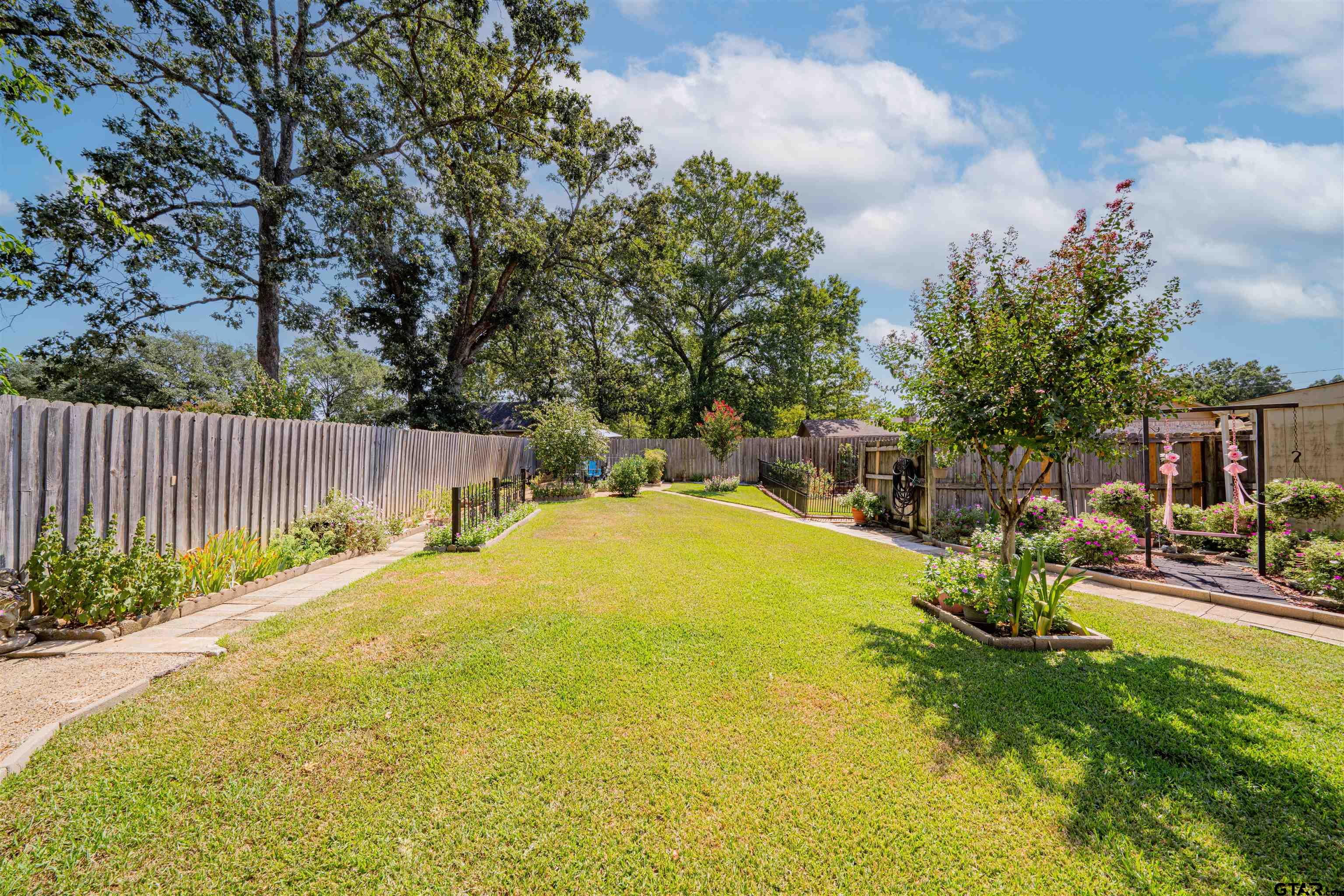 209 Cheryl Street Longview, TX 75604 - Photo 32 of 41 a view of back yard with swimming pool
