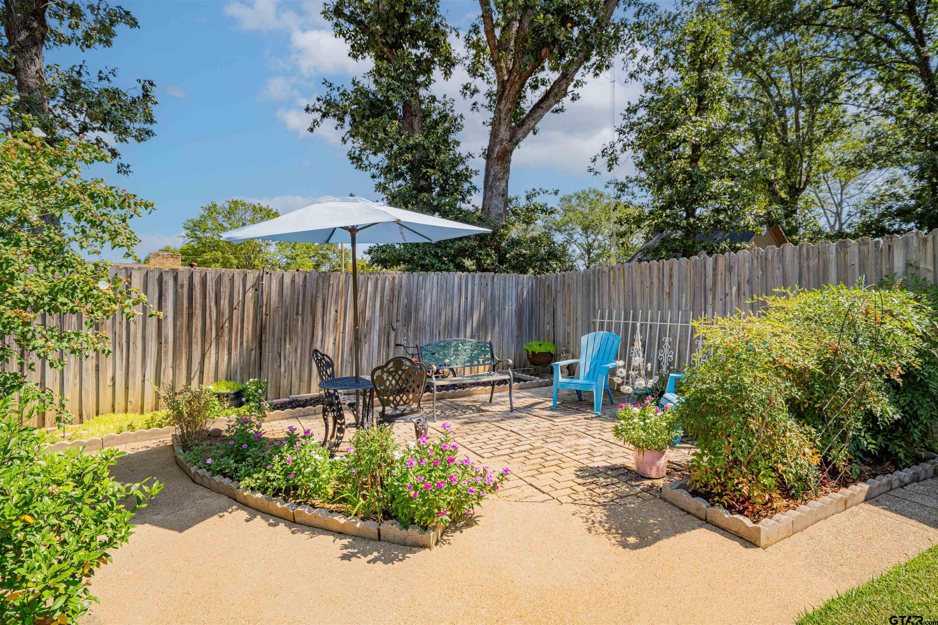 209 Cheryl Street Longview, TX 75604 - Photo 34 of 41 a garden view with a seating space