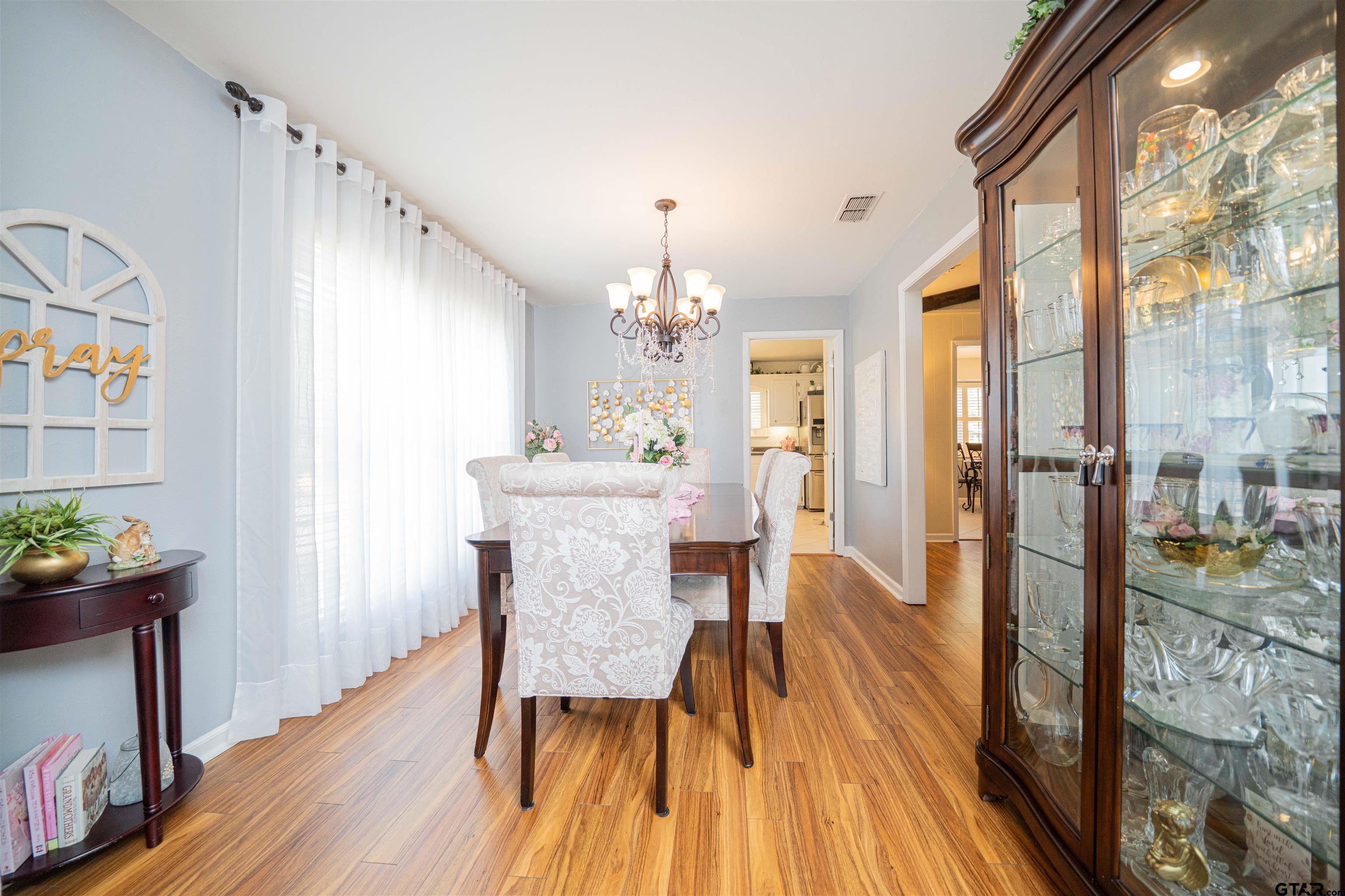 209 Cheryl Street Longview, TX 75604 - Photo 9 of 41 a view of a dining room with furniture and wooden floor