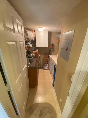 a view of a living room with furniture and a fireplace