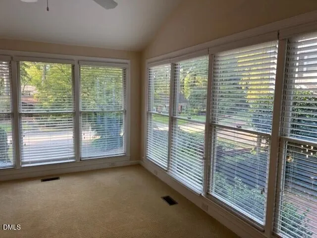 a view of a room with large windows