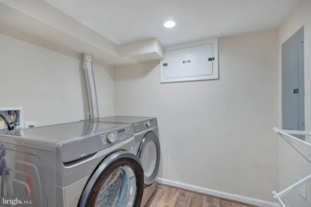 a view of storage and utility room with washer and dryer
