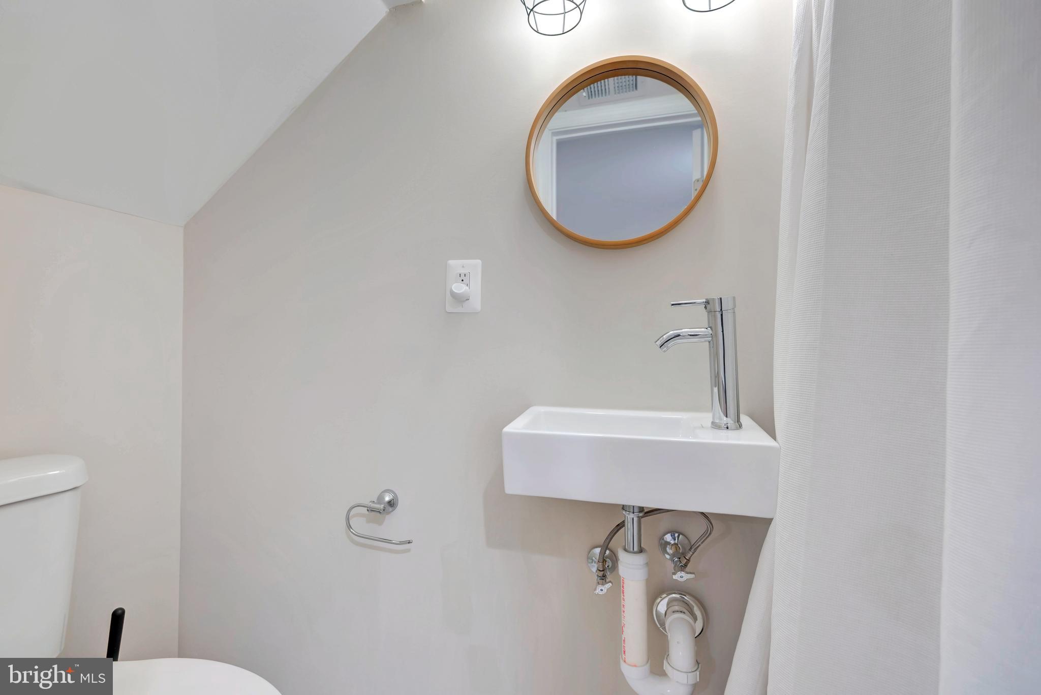 3428 Dix Street Northeast Washington, DC 20019 - Photo 16 of 21 a bathroom with a toilet and a sink