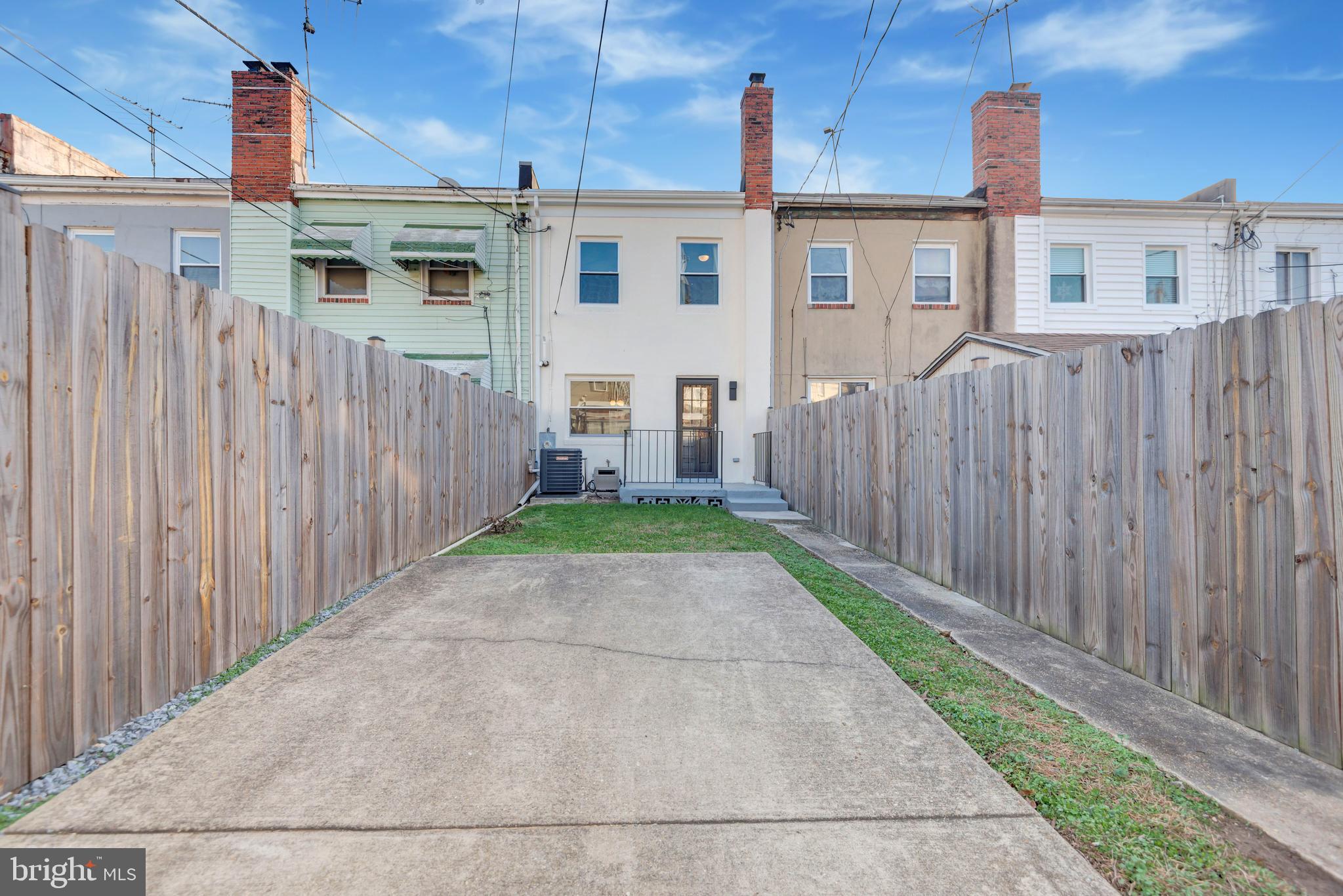 3428 Dix Street Northeast Washington, DC 20019 - Photo 18 of 21 a front view of a house with a garden