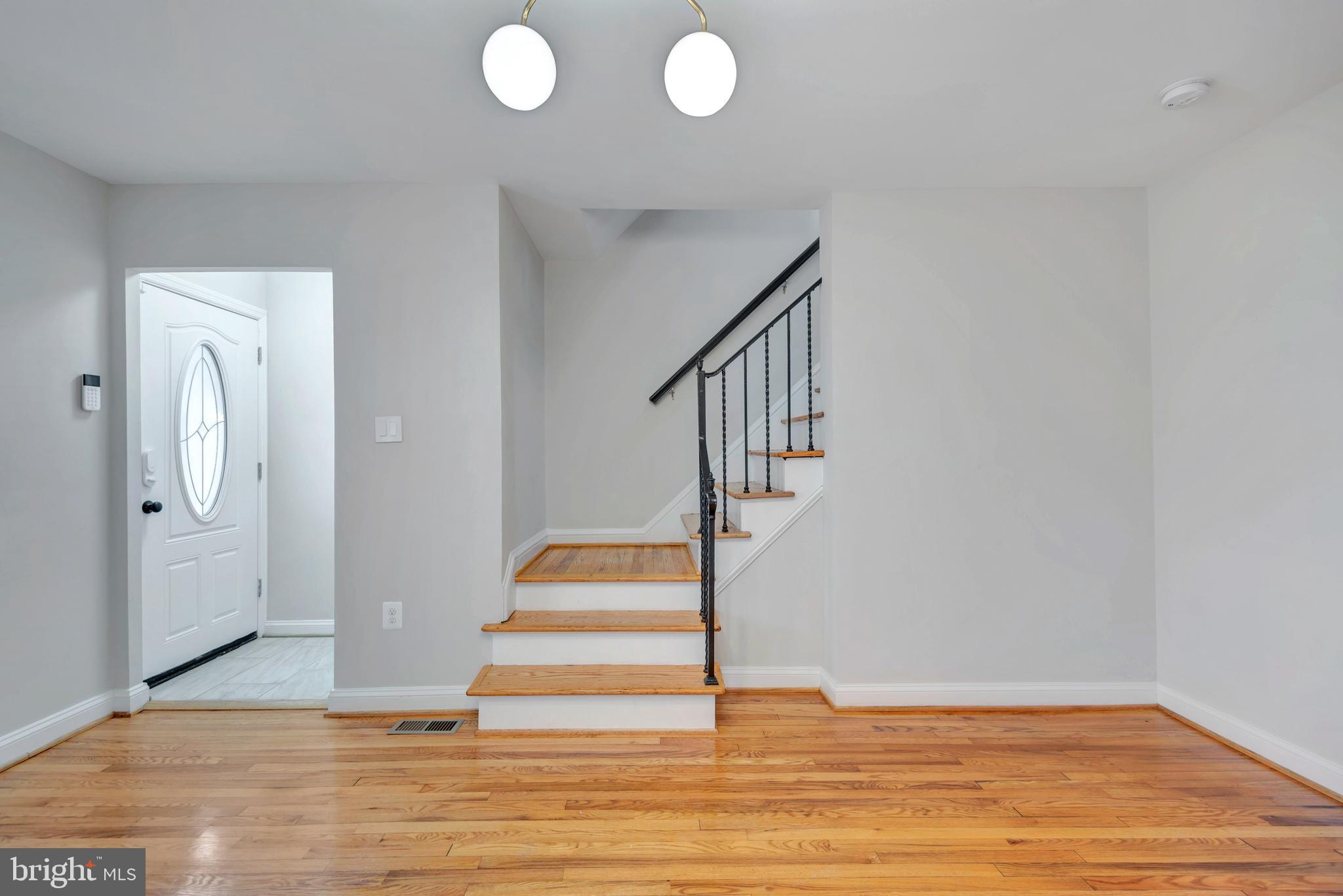3428 Dix Street Northeast Washington, DC 20019 - Photo 5 of 21 a view of entryway and hall with wooden floor