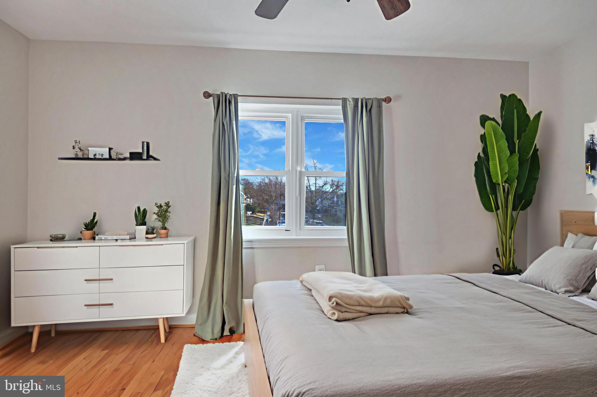3428 Dix Street Northeast Washington, DC 20019 - Photo 7 of 21 a bedroom with a bed and a window