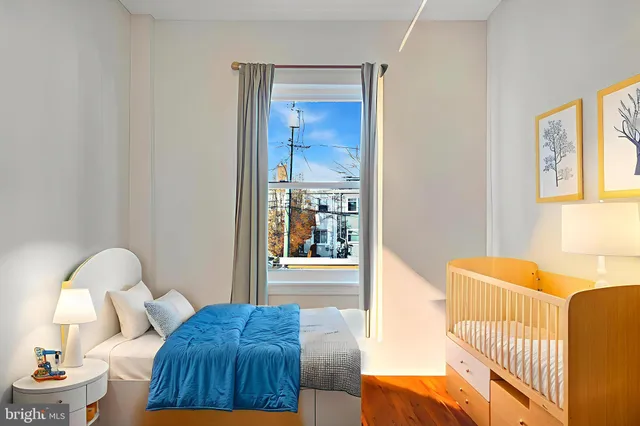 a bedroom with furniture and a window