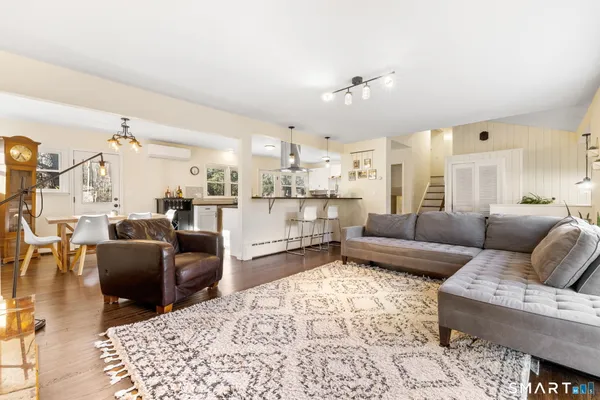a living room with furniture and a rug
