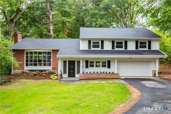front view of a house with a yard