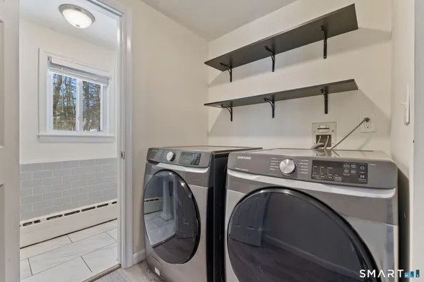 a utility room with dryer and washer