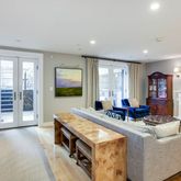 a living room with fireplace furniture and a flat screen tv