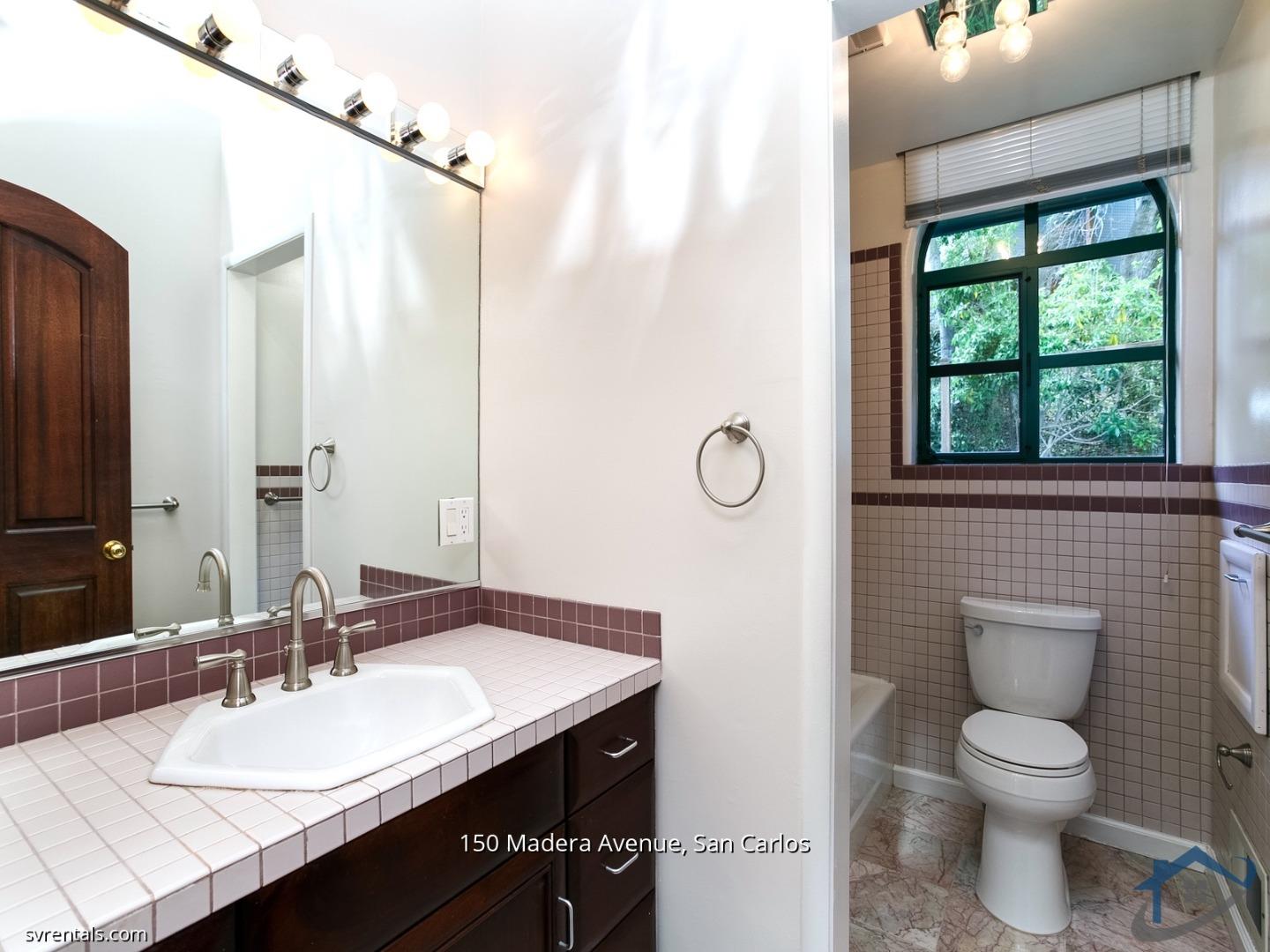 150 Madera Avenue San Carlos, CA 94070 - Photo 16 of 23 a bathroom with a sink a toilet and a mirror