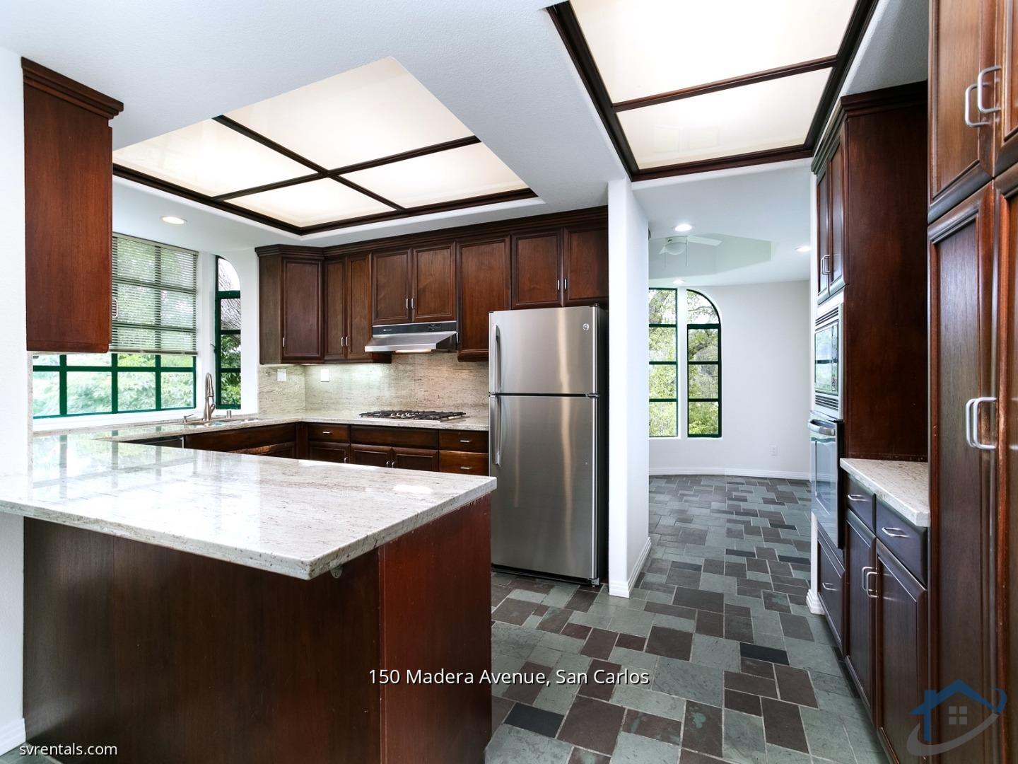 150 Madera Avenue San Carlos, CA 94070 - Photo 6 of 23 a kitchen with stainless steel appliances granite countertop a refrigerator a sink and a stove