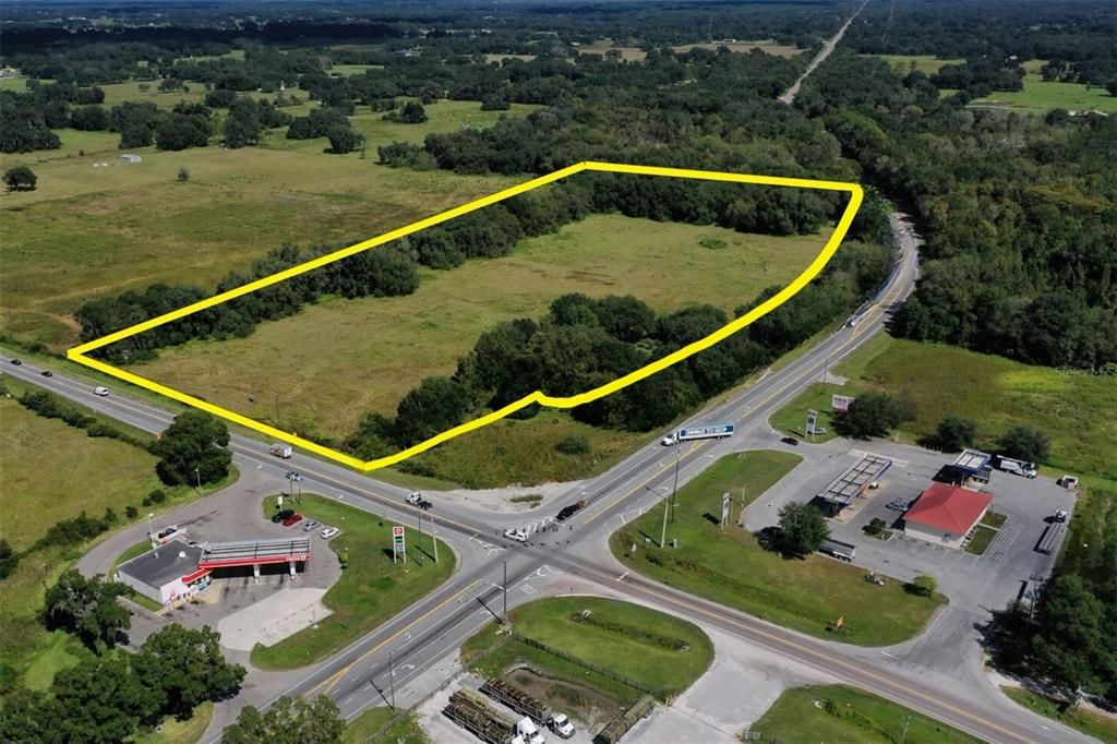 3070 Highway 50 Webster, FL 33597 - Photo 3 of 9 an aerial view of a tennis ground and a cars park side of the road