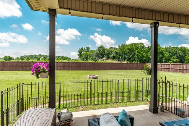 a living room with fireplace furniture and a wooden floor