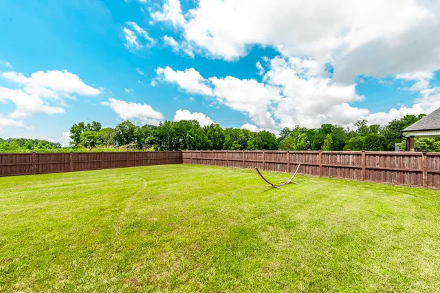 a living room with furniture fireplace and flat screen tv