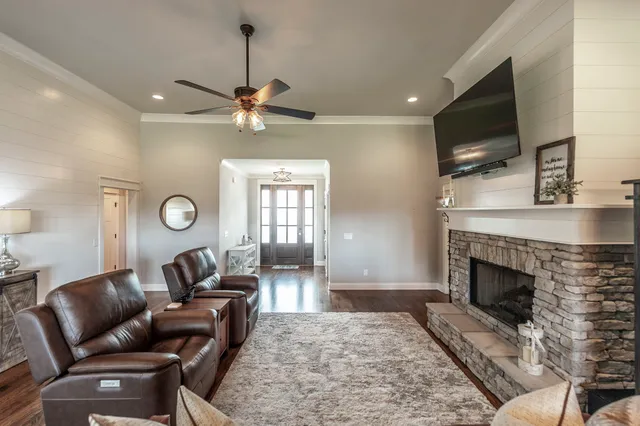 a kitchen with stainless steel appliances granite countertop a refrigerator stove microwave and sink