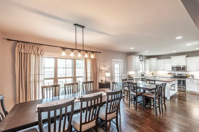 a bathroom with a granite countertop shower sink and mirror