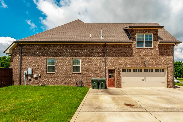 a house with yard in front of it