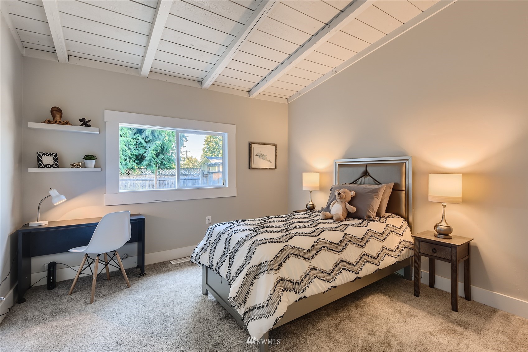 19125 Grannis Road Bothell, WA 98012 - Photo 15 of 24 a bedroom with a bed chair and a window
