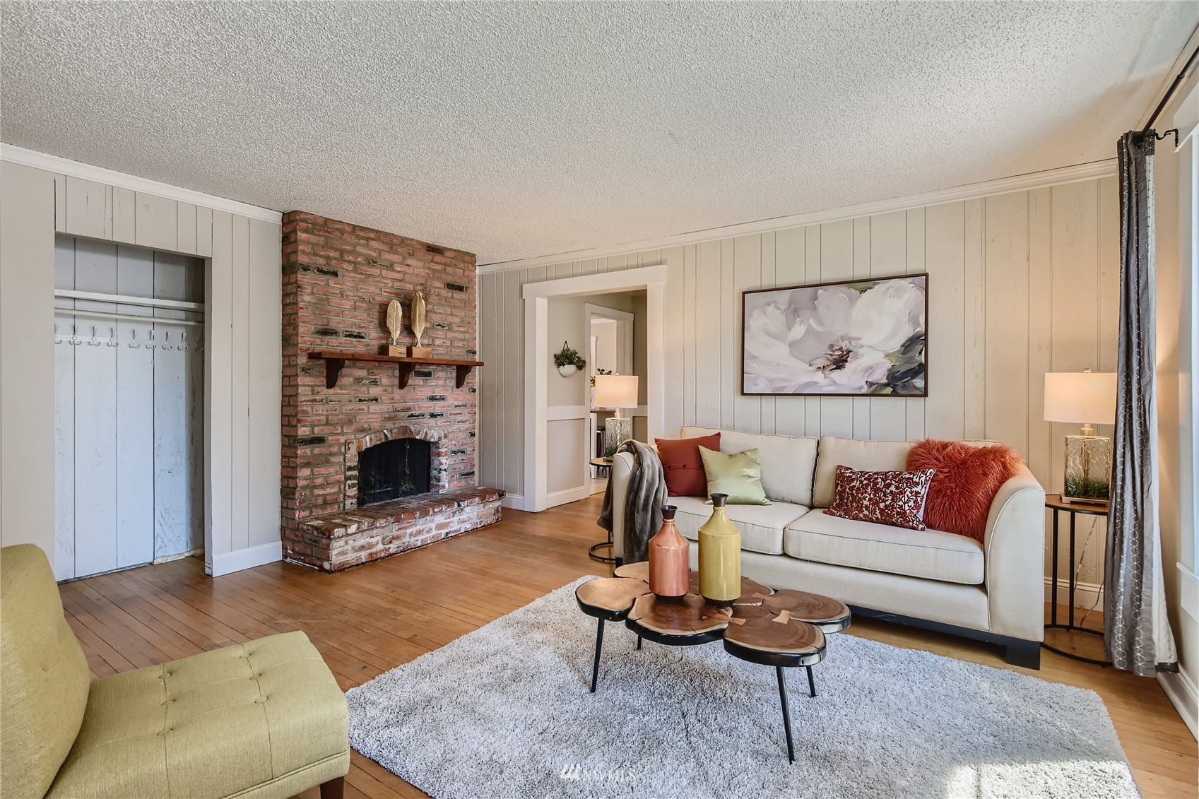 19125 Grannis Road Bothell, WA 98012 - Photo 2 of 24 a living room with furniture and a fireplace