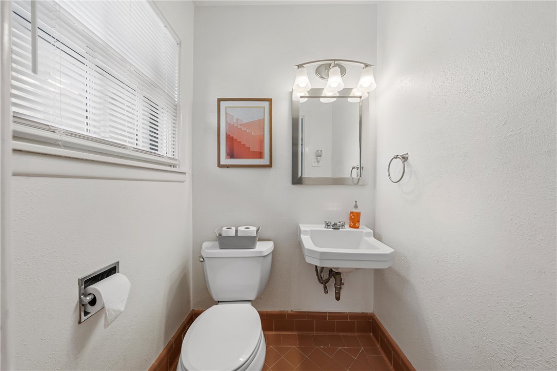4701 Edmond Avenue Waco, TX 76710 - Photo 21 of 26 a bathroom with a sink mirror and toilet
