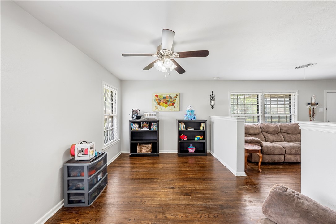 4701 Edmond Avenue Waco, TX 76710 - Photo 6 of 26 a living room with furniture and a flat screen tv