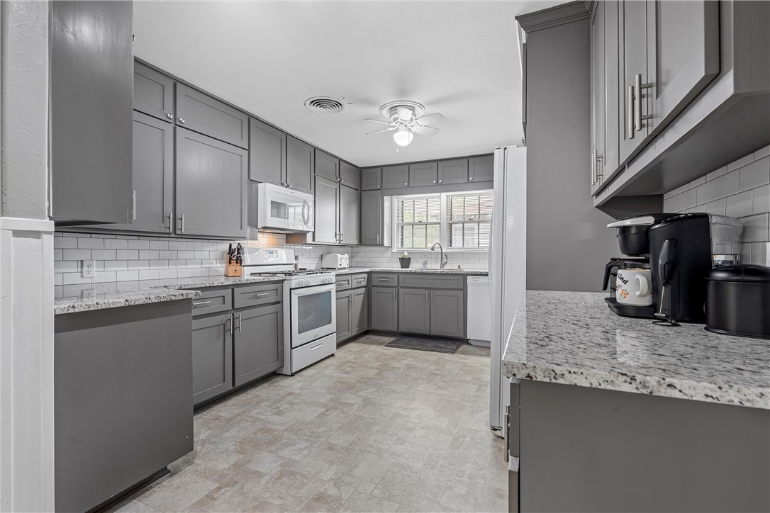 4701 Edmond Avenue Waco, TX 76710 - Photo 10 of 26 a kitchen with granite countertop a sink stainless steel appliances and cabinets