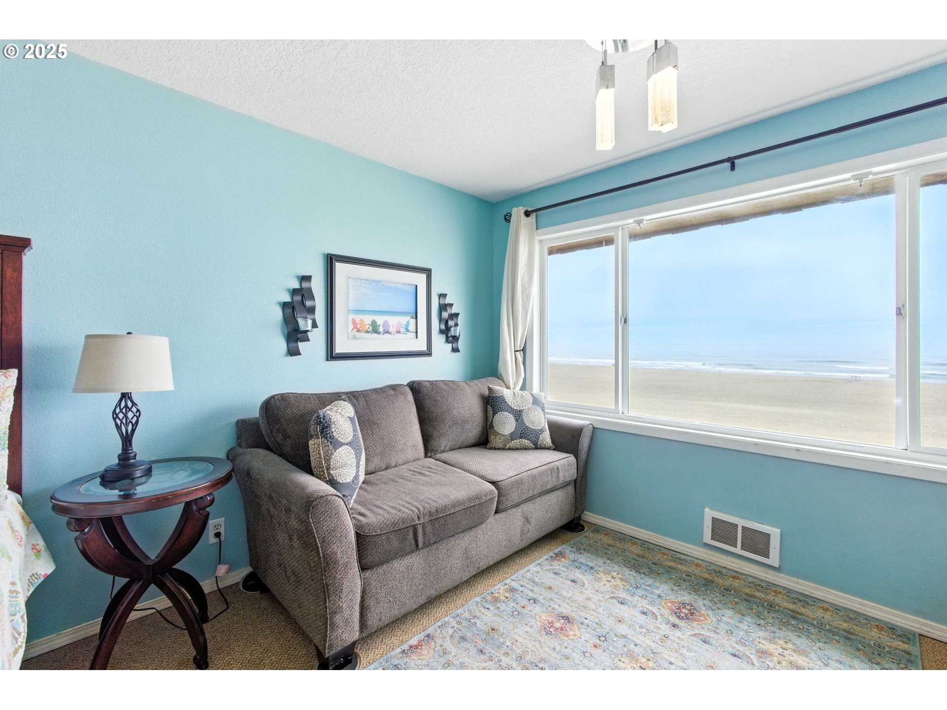 145 Northwest Inlet Avenue, Unit 217 Lincoln City, OR 97367 - Photo 11 of 28 a living room with furniture and a window