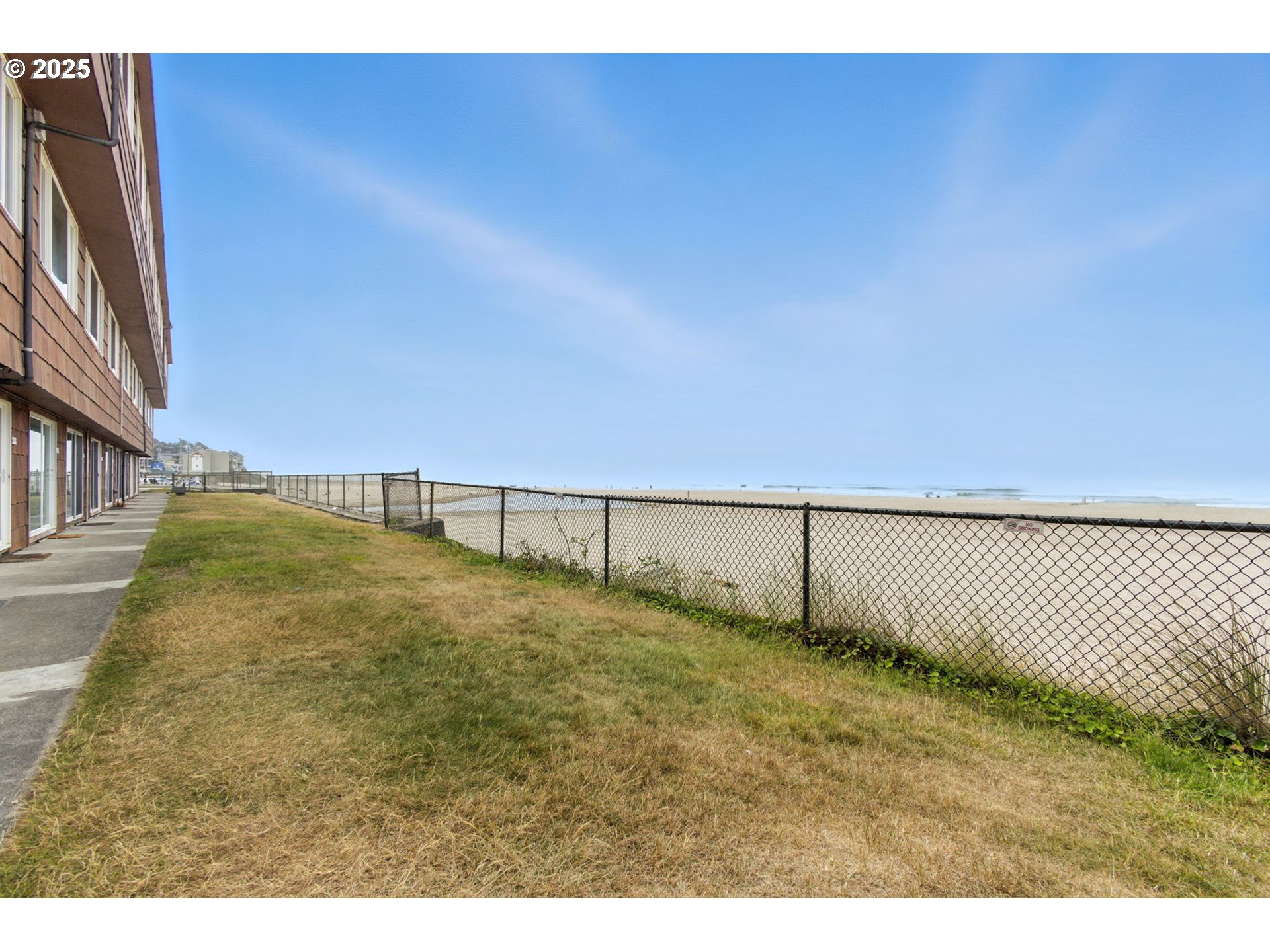 145 Northwest Inlet Avenue, Unit 217 Lincoln City, OR 97367 - Photo 27 of 28 a view of a backyard