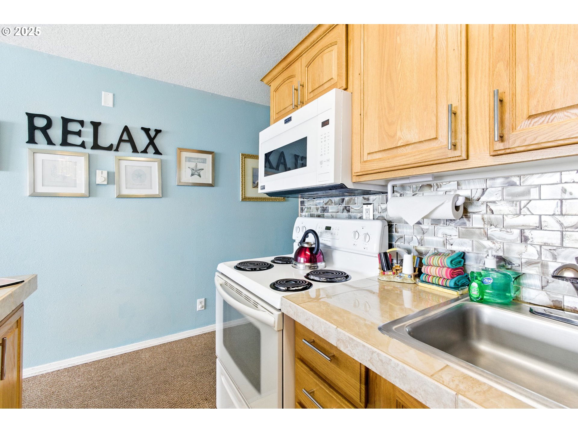145 Northwest Inlet Avenue, Unit 217 Lincoln City, OR 97367 - Photo 7 of 28 a kitchen with sink and cabinets