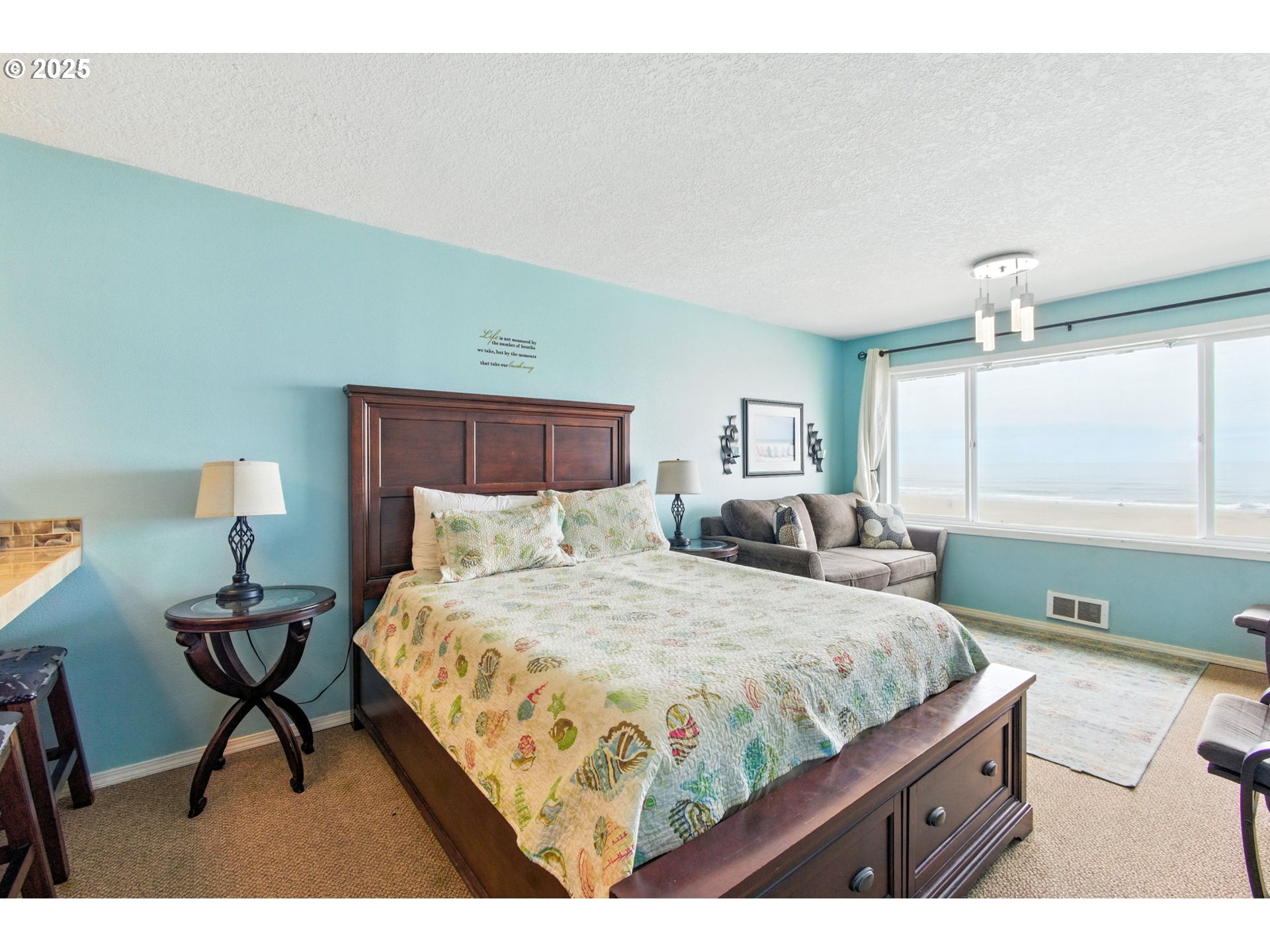 145 Northwest Inlet Avenue, Unit 217 Lincoln City, OR 97367 - Photo 8 of 28 a bedroom with a bed and window