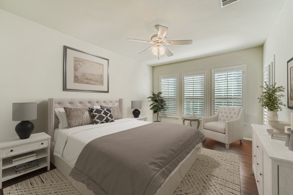 307 Mill Pond Path Georgetown, TX 78633 - Photo 14 of 26 Virtually staged primary bedroom with wood finished floors and ceiling fan