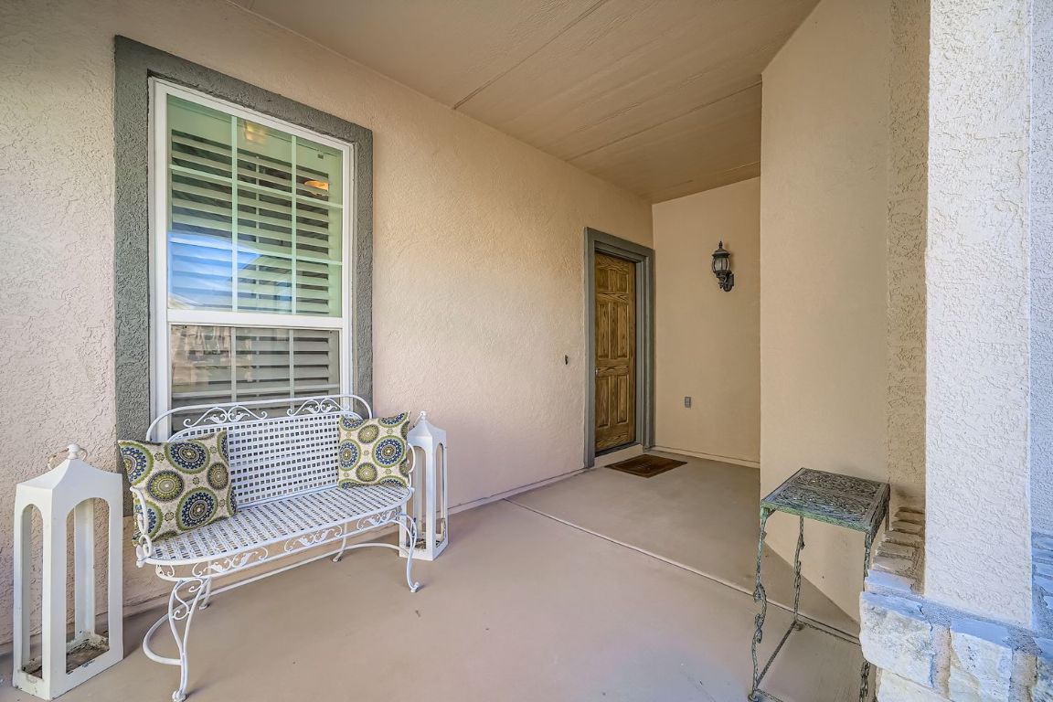 307 Mill Pond Path Georgetown, TX 78633 - Photo 3 of 26 View of exterior entry with stucco siding and a covered patio area