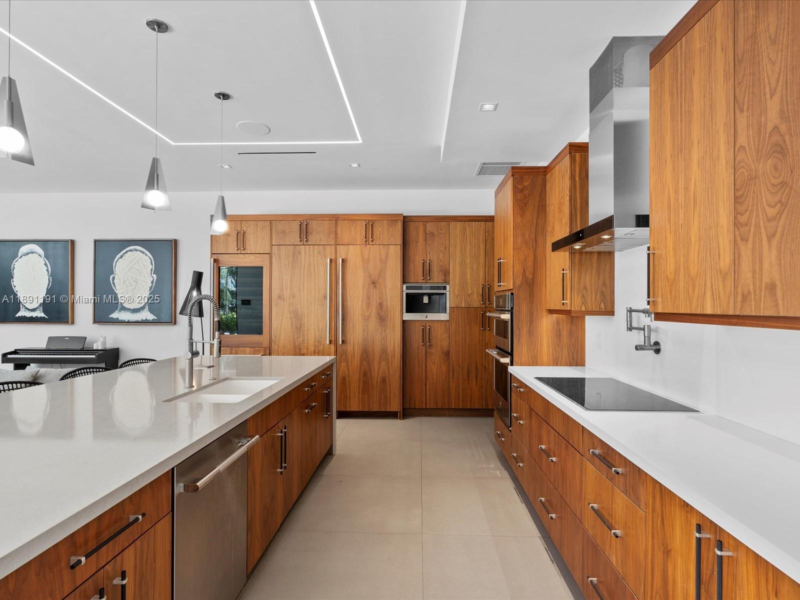 1736 Southeast 14th Street Fort Lauderdale, FL 33316 - Photo 12 of 54 a large kitchen with stainless steel appliances a sink and large cabinets