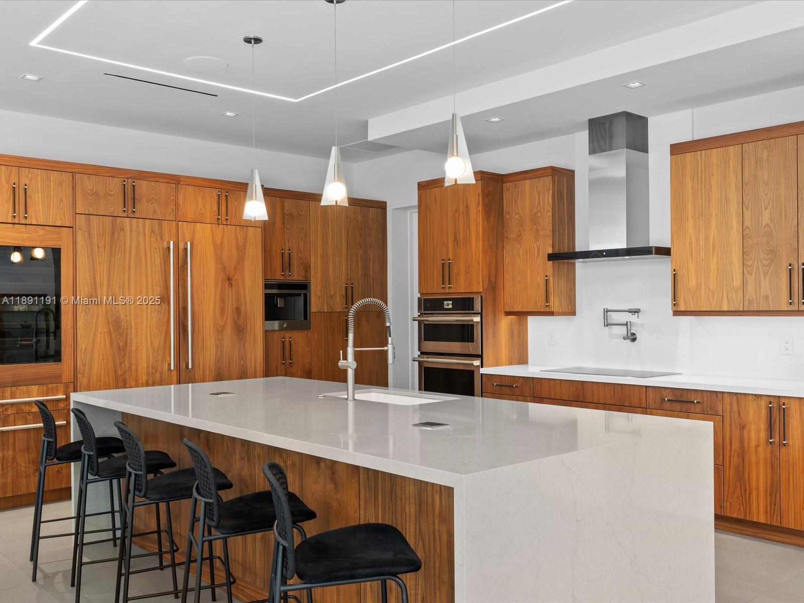 1736 Southeast 14th Street Fort Lauderdale, FL 33316 - Photo 13 of 54 a kitchen with stainless steel appliances a dining table chairs and a refrigerator