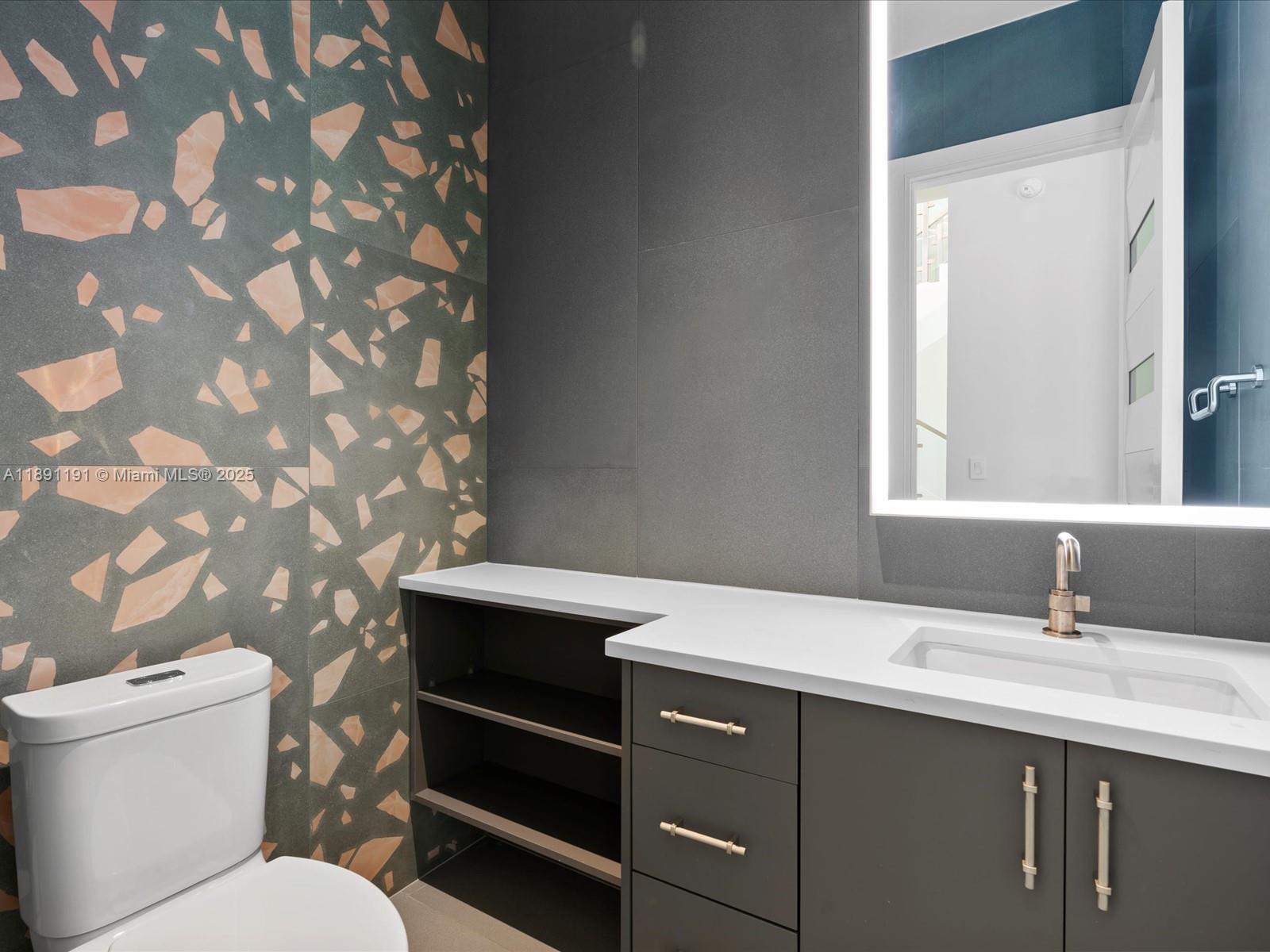 1736 Southeast 14th Street Fort Lauderdale, FL 33316 - Photo 19 of 54 a bathroom with a sink mirror vanity and toilet