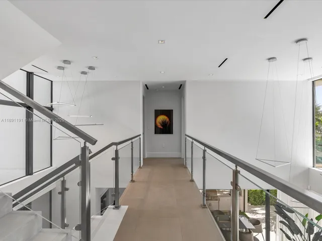 a bedroom with furniture and a flat screen tv