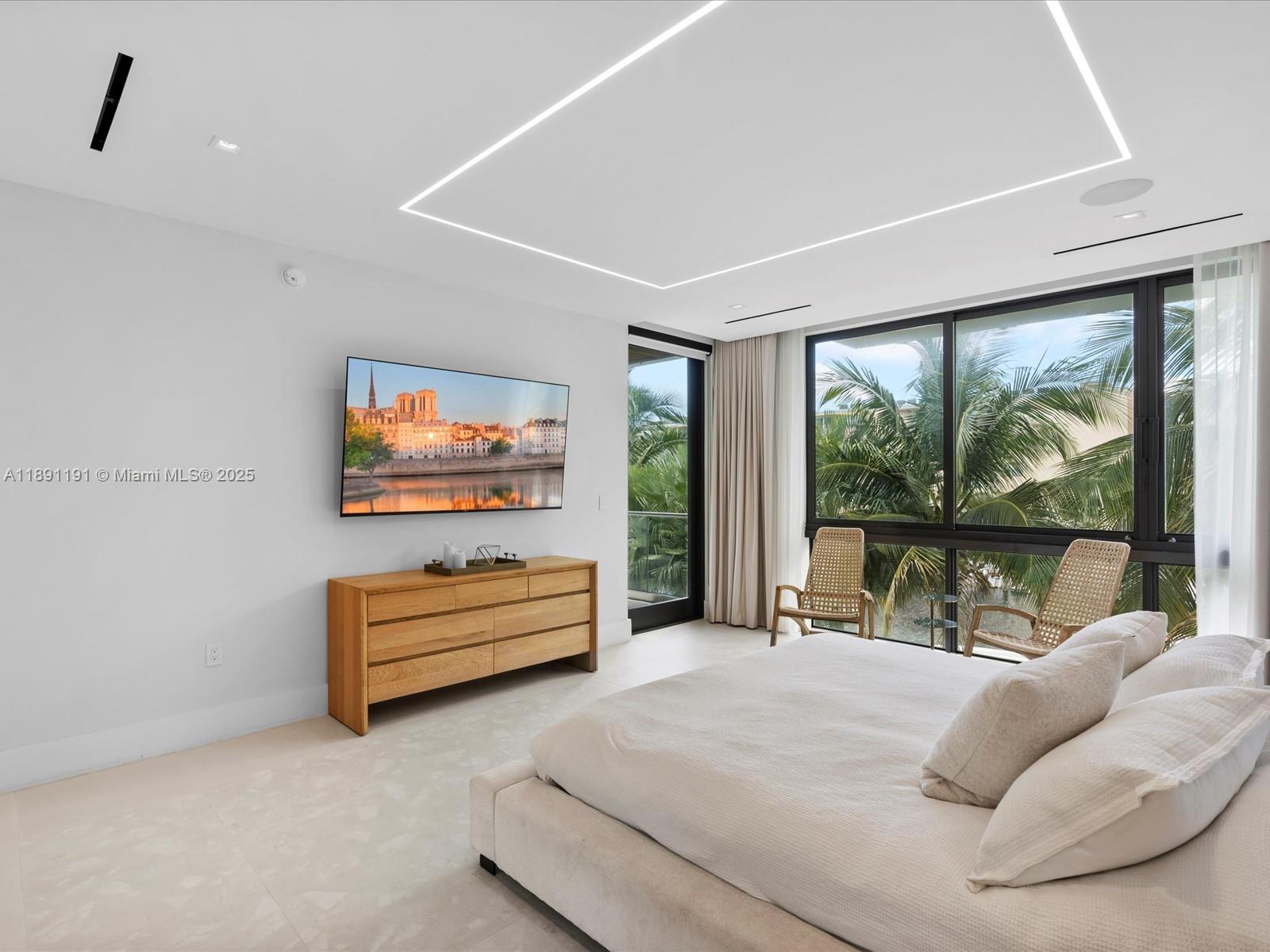 1736 Southeast 14th Street Fort Lauderdale, FL 33316 - Photo 23 of 54 a bedroom with furniture and a flat screen tv