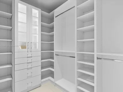 a bedroom with a bed and large windows