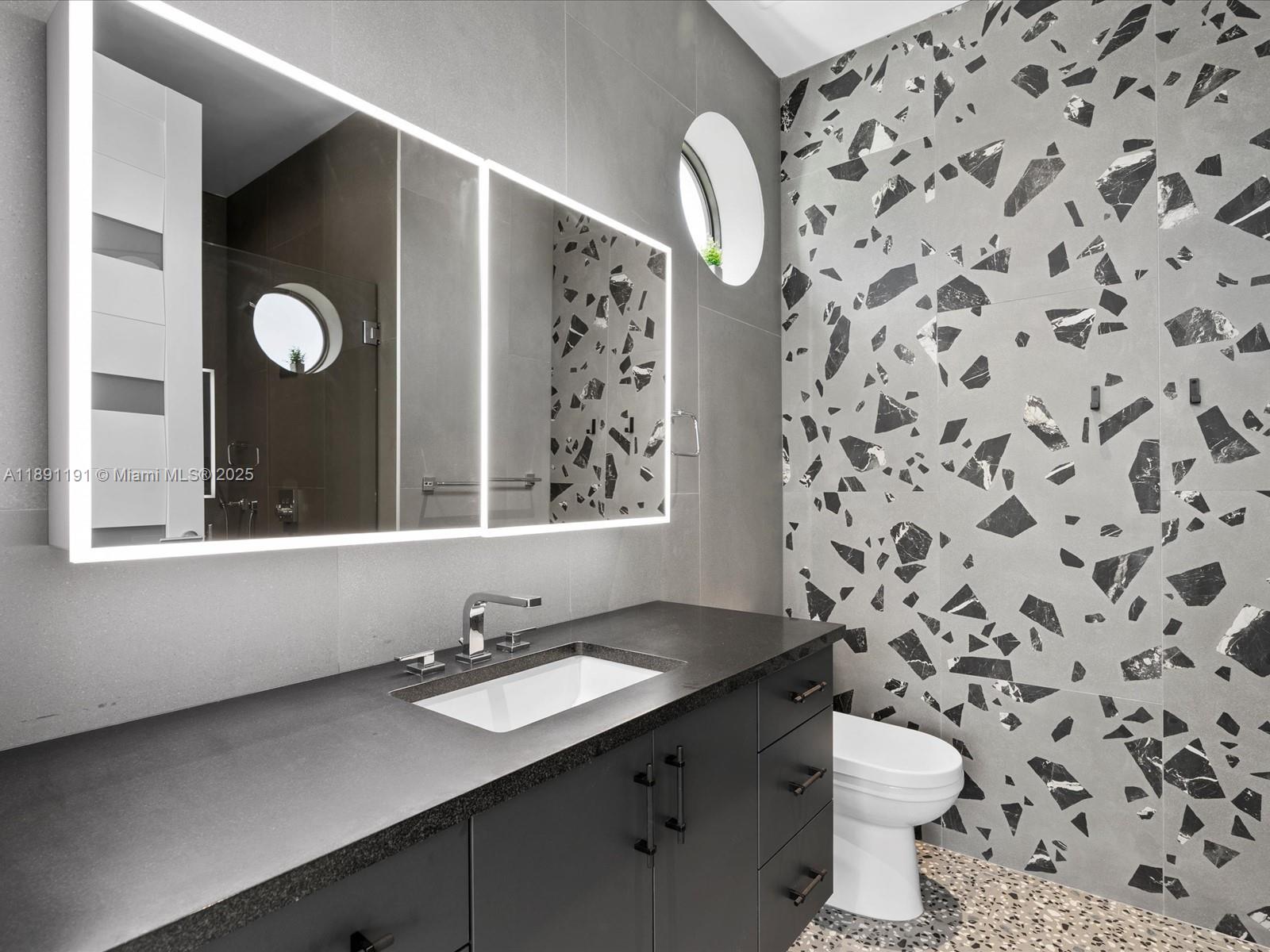 1736 Southeast 14th Street Fort Lauderdale, FL 33316 - Photo 32 of 54 a bathroom with a sink and a mirror