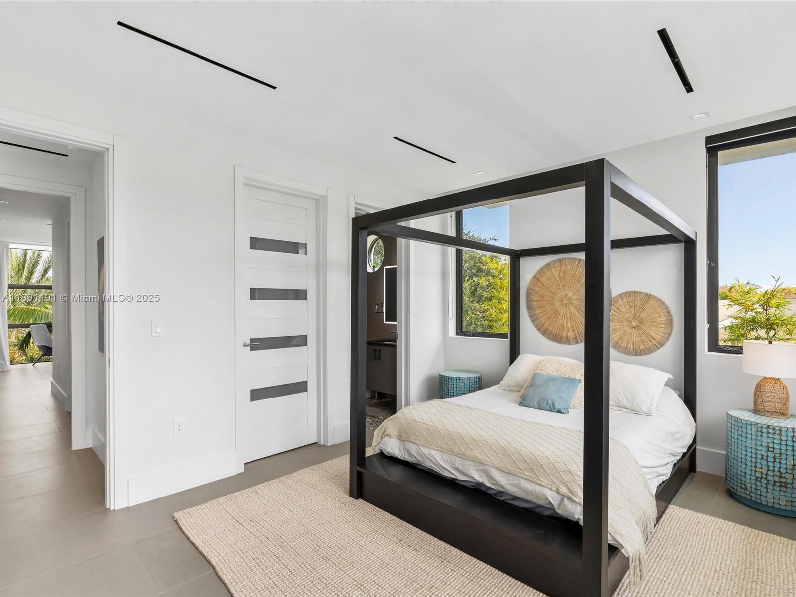 1736 Southeast 14th Street Fort Lauderdale, FL 33316 - Photo 35 of 54 a bedroom with a bed and a window