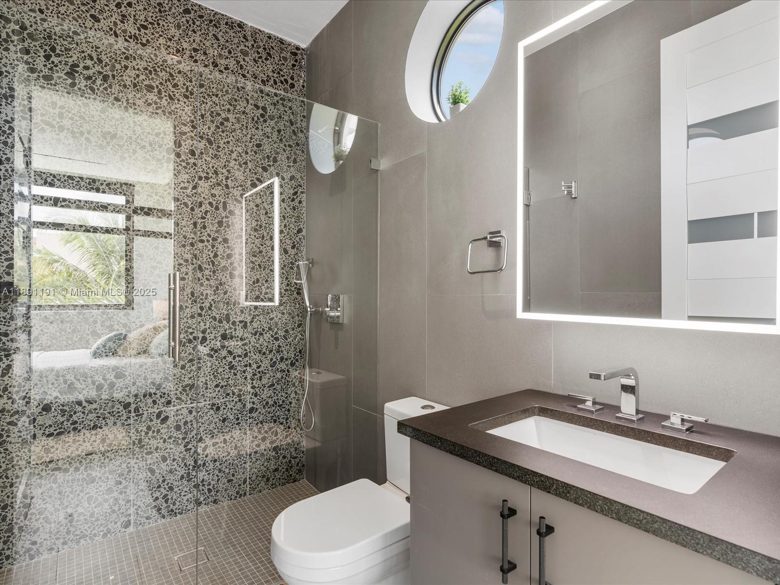 1736 Southeast 14th Street Fort Lauderdale, FL 33316 - Photo 36 of 54 a bathroom with a sink and a mirror