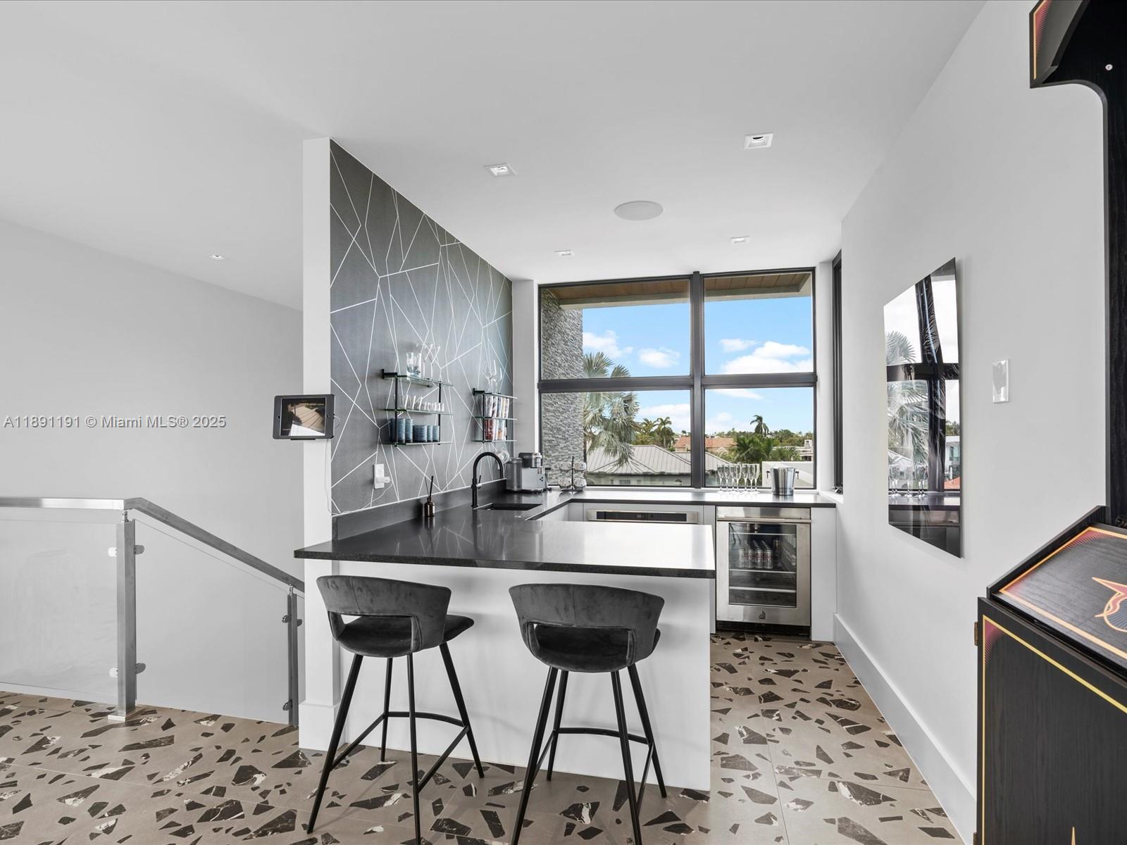 1736 Southeast 14th Street Fort Lauderdale, FL 33316 - Photo 38 of 54 a kitchen with stainless steel appliances kitchen island granite countertop a stove a sink and a refrigerator