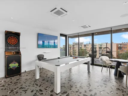 a work room with furniture and windows